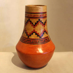 Band of Dineh rug design around the neck of a polychrome jar