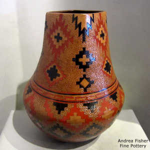 Dineh rug design and pine pitch coating on a tall square-neck jar