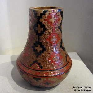 Dineh rug design and poine pitch coating on a large tall neck brown jar