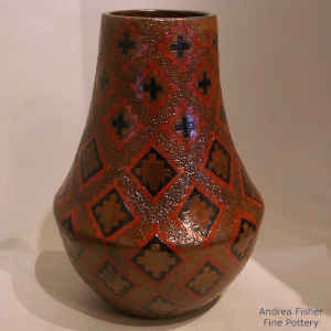 Dineh carpet design on a polychrome brown jar