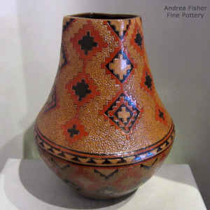 Dineh carpet design on a polychrome brown jar with a square opening