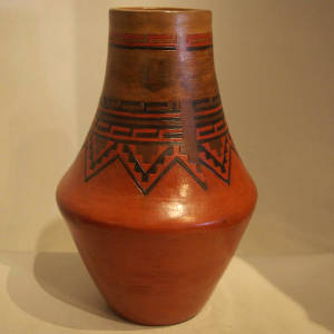 Dineh rug design on a tall neck jar