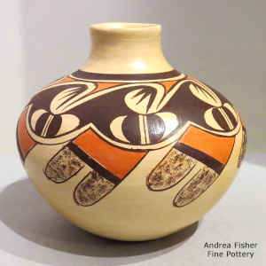Stylized migration pattern, bird element and geometric design plus fire clouds on a polychrome yellow ware Sikyatki-style jar