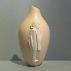 Figure of Taaqa on a polished buff jar