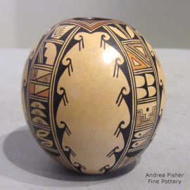 4-panel bird element and geometric design on a polychrome seed pot