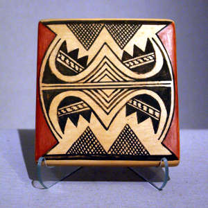 Bat wing and geometric design on a polychrome tile