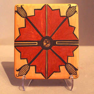 Four-direction, corn and geometric designs on a polychrome tile