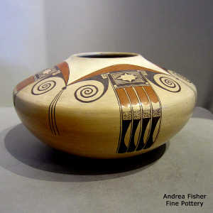 Black and red eagletail and geometric design on a yellow ware jar