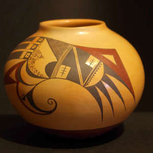 Bird element and geometric design on a polychromeyellow ware jar