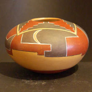 Kiva step and geometric design on a polychrome yellow ware jar