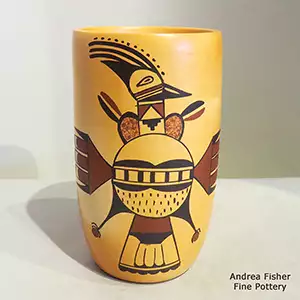 A bird element and geometric design with fire clouds on a polychrome cylinder