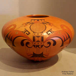 Stylized hummingbird, eagletail and geometric design on a polychrome yellow ware jar