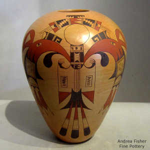 A thunderbird and geometric design on a polychrome yellow ware jar