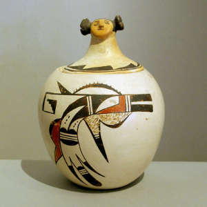 Bird element and geometric design on a lidded polychrome cookie jar