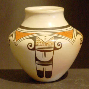 Red and black Awatovi star and bird element designs on a whiteware jar