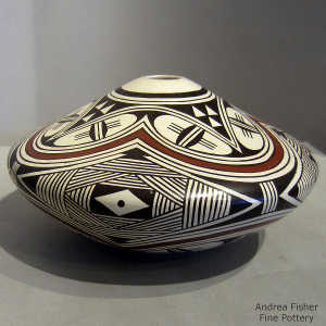 Geometric design on a polychrome white ware seed pot