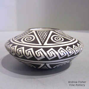 Awatovi star, spiral and geometric design on a black and white jar
