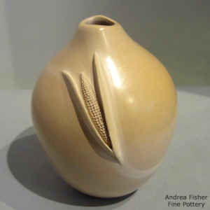 Ear of corn applique on a tan jar with an organic opening