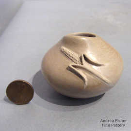 Ear of corn applique on a tan seed pot