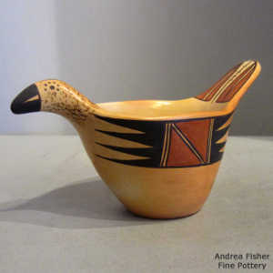 Bird element design on a polychrome yellow ware bird effigy bowl
