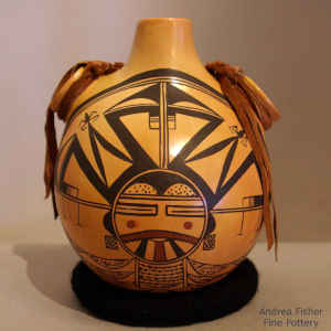 Stylized katsina design on a polychrome canteen