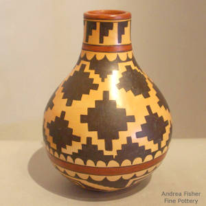 Navajo rug design on a polychrome yellow ware jar