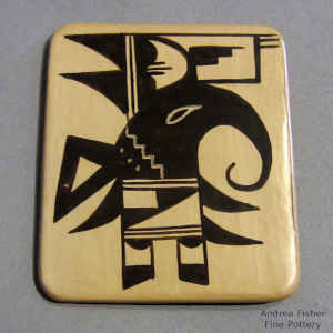 Bird element and geometric design in black on a yellow tile