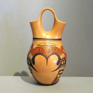 Stylized eagle design on a yellow ware wedding vase