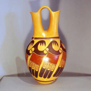 Black and red eagletail and migration pattern design on a yellow ware wedding vase