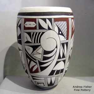 Bird element and geometric design on a polychrome whiteware jar