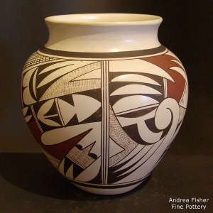 Black and red geometric design on a white jar
