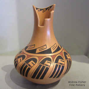 Long-haired kachina and geometric design on a long neck vase with a kiva step cut opening
