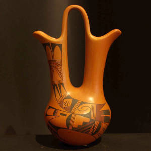 Red and black bird element and shard designs on a yellowware wedding vase