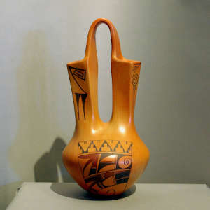 Red and black bird element and geometric design on a yellow ware wedding vase