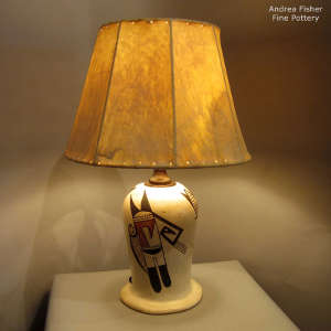 Bird element, corn and geometric design on a polychrome lamp