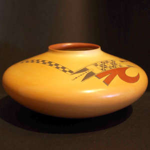 Red and black bird element and geometric design on a Sikyatki-style yellowware jar