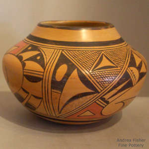 Bird element and large shard geometric design on a polychrome yellow ware jar