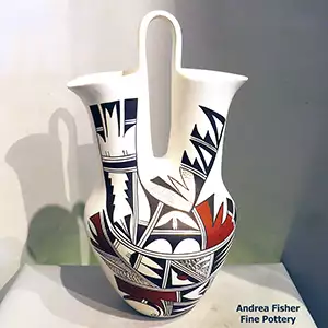 A bird element and geometric design on 2 sides of  apolychrome wedding vase
