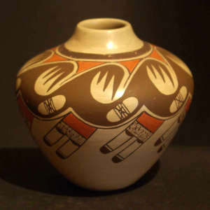 Bear claw, eagle tail and geometric design on a polychrome pot