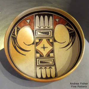 Eagletail and geometric design on a polychrome yellow ware bowl made for hanging
