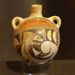 Bird element and tadpole design on a polychrome canteen