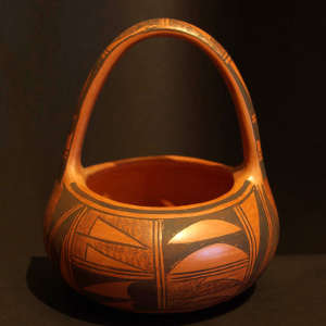 Black shard and geometric design on a red pot