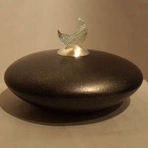 Sterling silver lid on a black micaceous seedpot