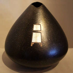 Sterling silver inlay on a black micaceous seedpot
