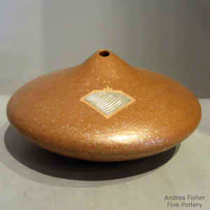 Red micaceous seed pot with a Sterling silver Shifting Sands design inlay