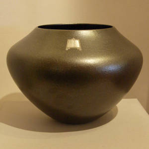 Three sterling silver inlays in a black micaceous jar