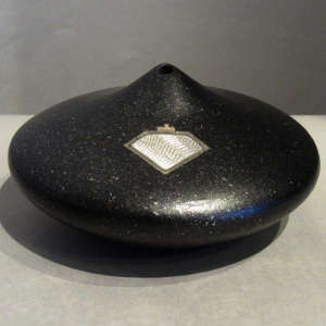 Silver inlay on a micaceous black seedpot