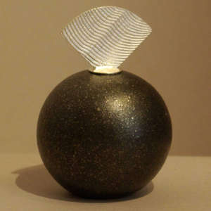 Sterling silver Shifting Sands design fan lid on a black micaceous seedpot