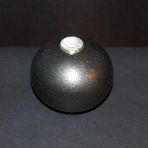 Sterling silver Shifting Sands design lid on a black micaceous seed pot