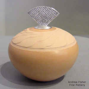 Salmon seed pot lightly carved with Shifting Sands design and with a sterling silver Shifting Sands design lid